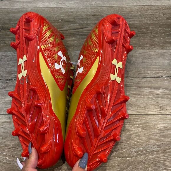Under Armor red and gold football cleats NWOB